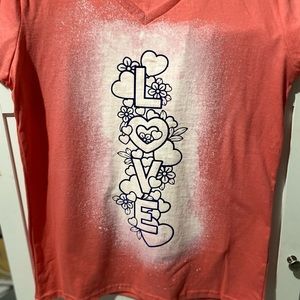 I made this shirt myself. It’s a bleach with vinyl. It’s a size medium.